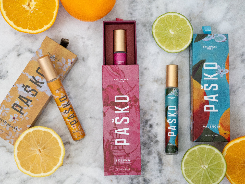 Pasko products with citrus fruits on a marble surface